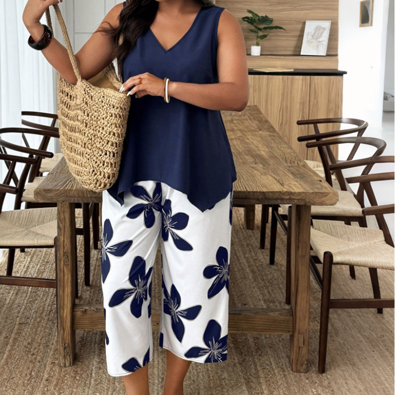 👚🌸 NUR FÜR KURZE ZEIT: 50% RABATT! Set aus asymmetrischem Damenoberteil & Caprihose mit Blumenmuster – Vielseitig, farbenfroh, bequem 🌺